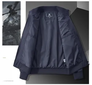 Detail of navy blue flight jacket featuring inner pocket and ribbed hem finish