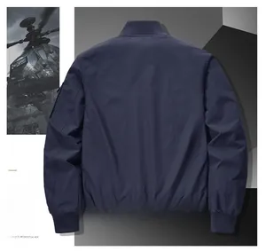 Back view of navy blue bomber jacket with ribbed cuffs and utility sleeve zipper pocket