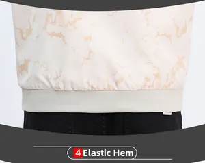 Detailed macro view of the elastic ribbed hem on a marble pattern casual jacket