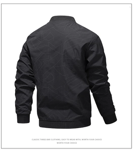 Detail of men's bomber jacket back featuring grey geometric patterns and ribbed hem