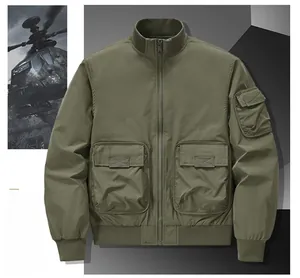 Detail of army green bomber jacket with utility pockets and ribbed cuffs on military background