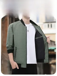 Detailed view of olive green bomber jacket with geometric patterns and ribbed collar