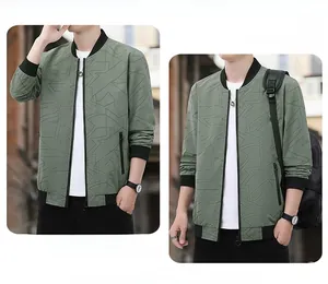 Detail of a men's sage green bomber jacket featuring geometric textures and zip pockets
