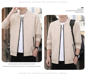 Detailed view of beige men's bomber jacket with geometric patterns and black zipper