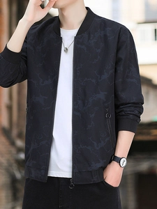 Men's navy blue varsity jacket with marble print and ribbed cuffs in urban outdoor setting