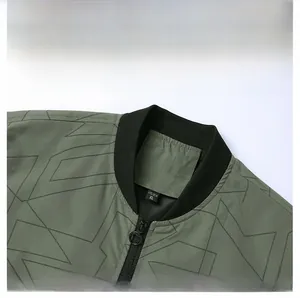 Detail of army green sports jacket showing ribbed baseball collar and metal zipper puller