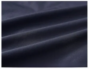 Macro shot of the navy blue textile texture showing soft fabric weave and craftsmanship
