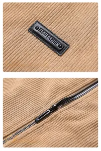 Detail view of camel corduroy fabric with metal zipper and fashion leather patch