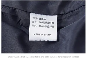 Detail of the washing label showing 100% polyester fabric for the men's jacket