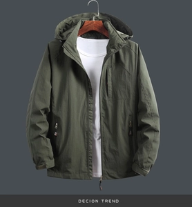 Detail of army green windproof jacket showing hooded design and mesh lining texture
