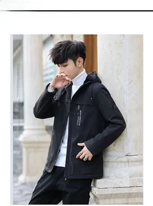 Detail of windproof black men's hooded jacket featuring plush lining and sport chest pocket