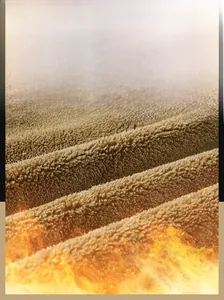 Detailed macro view of soft brown fleece lining showcasing warm knitting fabric texture