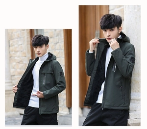 Detail of dark green hooded jacket with black fleece lining and sportmens zipper print