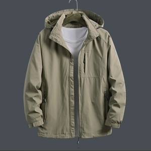 Front view of khaki men's hooded windbreaker jacket with zipper pockets on dark background
