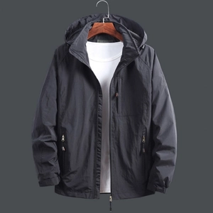 Men's dark gray hooded windbreaker with zip pockets on a wooden hanger display