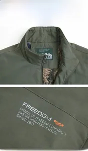 Detail view of army green outdoor vest featuring embroidery and high-quality stand collar