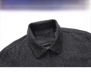 Detail of dark grey business jacket collar with high-quality metal zipper and refined texture