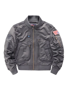 Dark gray tactical bomber jacket with military patches and rib-knit cuffs on white background