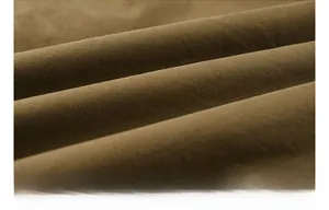 Macro shot of high-quality brown woven cotton fabric texture with soft warm fleece lining
