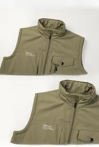 Detail view of military green outdoor vest featuring stand collar and ribbed armholes