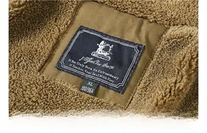 Close-up of brown cotton jacket collar showing plush fleece texture and XL size label