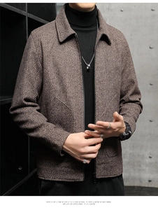 Detail of brown textured wool jacket with metal zipper closure and neat lapel collar