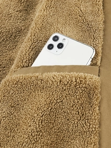 Mens cotton fleece business jacket with deep pocket holding a smartphone as scale