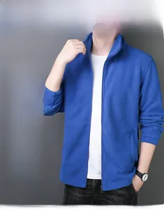 Detail of men's blue fleece jacket showing slim fit cut and soft thermal texture
