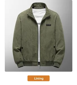 Detail view of military green corduroy jacket with leather patch and ribbed texture