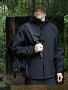 Detail of waterproof windbreaker with adjustable hood and Velcro cuffs in the forest
