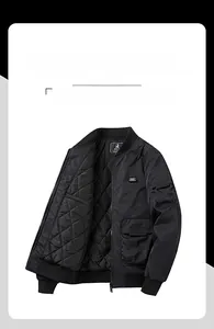 Detail of black bomber jacket featuring diamond quilted lining and utility arm pocket