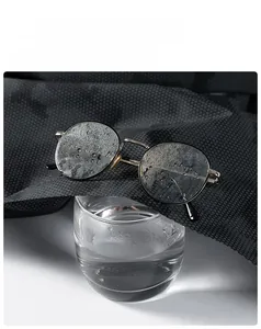 Detail shot showing steam passing through breathable mesh fabric of men's outdoor jacket