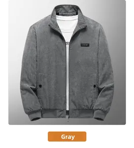 Close-up of grey corduroy jacket with ribbed cuffs and leather chest patch detail