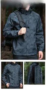Detail of grey camouflage hooded windbreaker with adjustable velcro cuffs and mesh lining