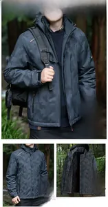 Detail of men's fleece-lined waterproof jacket with black geometric camo and hood