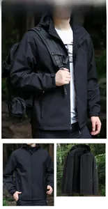 Close-up of black hooded outdoor jacket with adjustable velcro cuffs and drawstrings