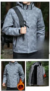 Detail view of deep grey camo outdoor jacket with warm fleece lining and adjustable hood