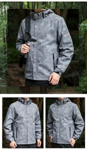 Detail of gray pixel camouflage windbreaker with adjustable velcro cuffs and zip pocket