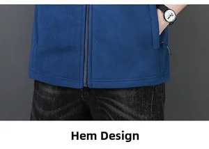 Detail view of the hem on a men's blue fleece jacket with zipper and side pocket