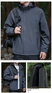 Detail view of dark grey hooded outdoor jacket with adjustable drawstrings and velcro cuffs