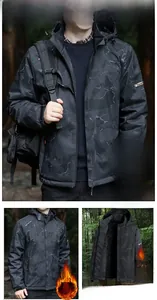 Detail view of men's dark camo outdoor jacket with warm fleece lining and removable hood