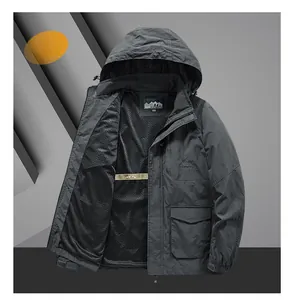 Detail of gray outdoor hooded jacket with breathable black mesh lining and embroidered logos