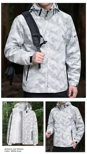 Detail of gray camo waterproof jacket showing the hood, zipper pockets, and adjustable cuffs
