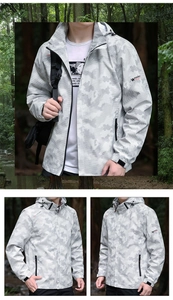 Detail view of men's hooded windbreaker jacket in light grey camouflage for hiking