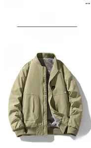 Detail of olive green bomber jacket featuring warm grey fleece lining and utility pockets