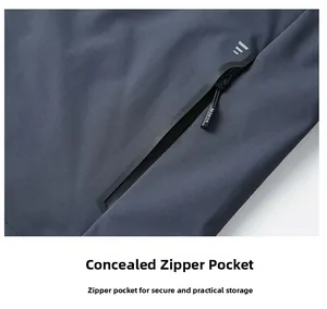 Detail of dark grey jacket featuring a hidden zipper pocket and RASHION woven puller cord