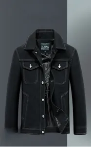 Detail of black denim jacket with warm fleece lining and map print interior lining