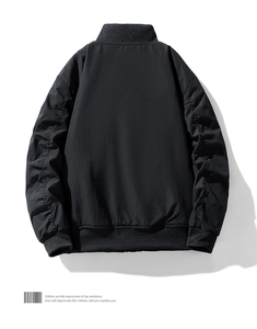 Rear view of black bomber jacket with ribbed cuffs and stand collar on white background