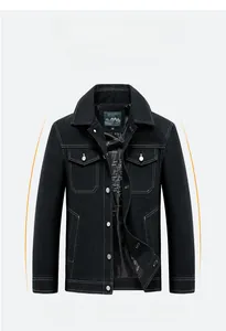 Detail of black denim jacket featuring white contrast stitching and metallic buttons
