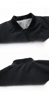 Detail of black winter jacket featuring warm gray fleece lining and ribbed stand collar